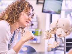 Student looking at skull